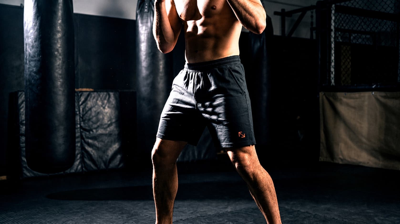 Fighter in motion wearing Fight Form natural-fiber shorts.