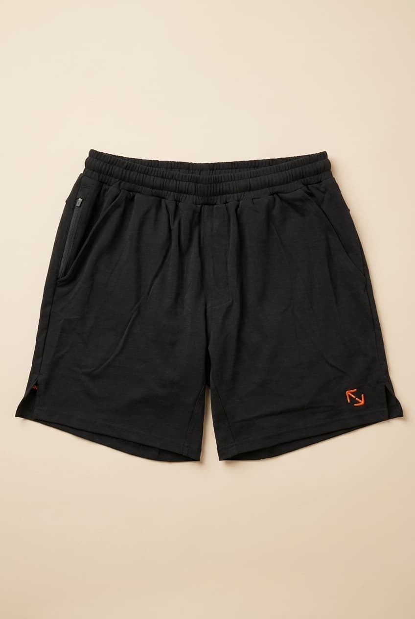 Fight Form Training Short, front — black 7-inch natural fiber gym and training short with side pockets.